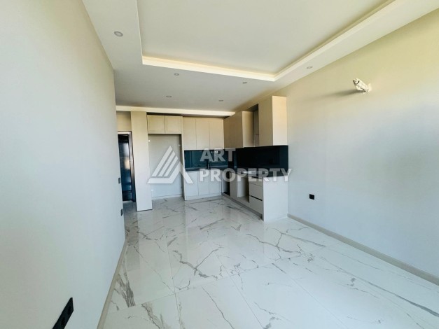 Апартаменты 1+1 в 250 метрах от моря в Каргыджаке. Есть рассрочка платежа - Ракурс 3