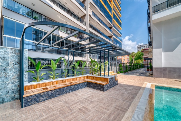 Однокомнатная квартира 1+1, новая резиденция, 60 кв.м. Махмутлар, Алания - Ракурс 3