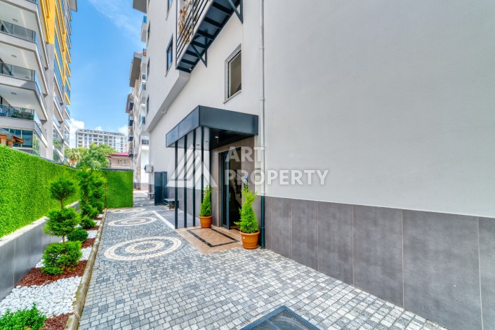 Однокомнатная квартира 1+1, новая резиденция, 60 кв.м. Махмутлар, Алания - Ракурс 6