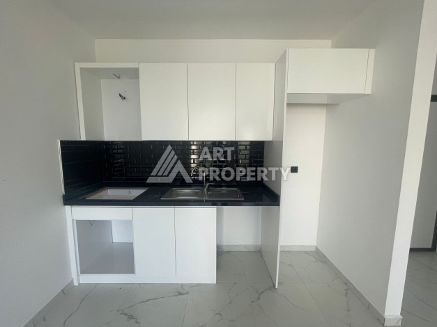 Однокомнатная квартира 1+1, новая резиденция, 60 кв.м. Махмутлар, Алания - Ракурс 9