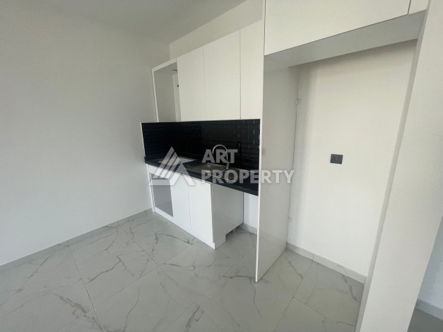 Однокомнатная квартира 1+1, новая резиденция, 60 кв.м. Махмутлар, Алания - Ракурс 11