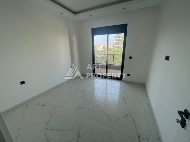 Однокомнатная квартира 1+1, новая резиденция, 60 кв.м. Махмутлар, Алания - Ракурс 12