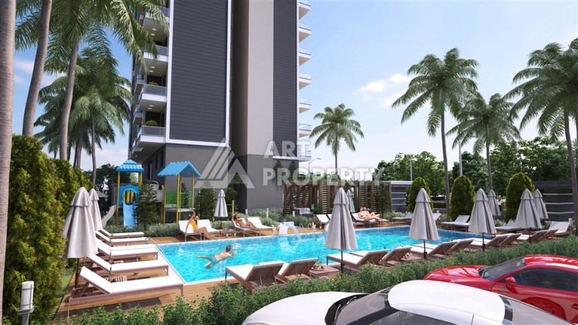 Резиденция с квартирами 1+1, дуплексами 2+1 и 3+1 в Махмутларе, от 50 до 133 кв.м. - Ракурс 4