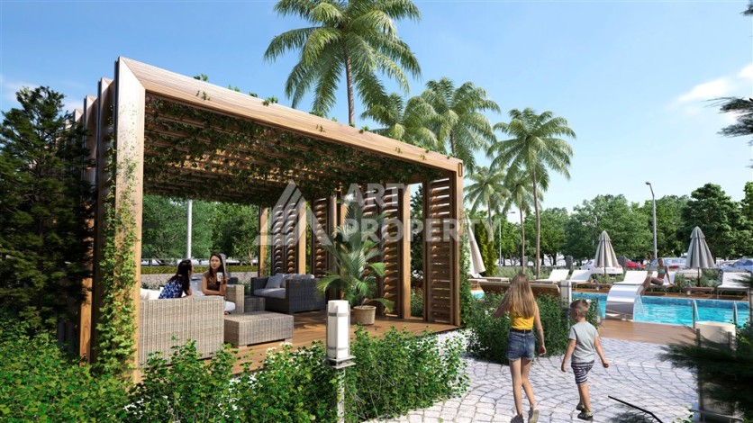 Резиденция с квартирами 1+1, дуплексами 2+1 и 3+1 в Махмутларе, от 50 до 133 кв.м. - Ракурс 5