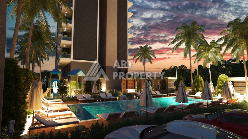 Резиденция с квартирами 1+1, дуплексами 2+1 и 3+1 в Махмутларе, от 50 до 133 кв.м. - Ракурс 8