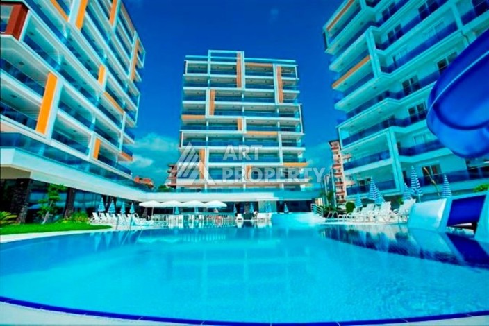 Просторная квартира 1+1 в резиденции с отельной концепцией, 65 кв.м. Тосмур, Алания - Ракурс 13