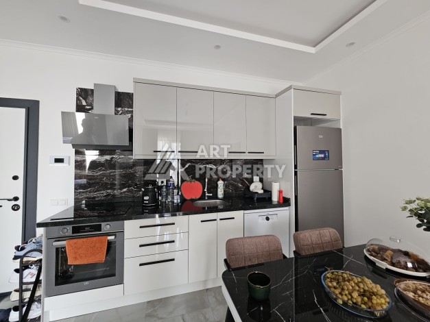 Уютная квартира 1+1 в новом комплексе в центре Махмутлара, 56 кв.м. - Ракурс 6