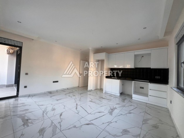 Квартира 2+1 в современном комплексе в центре Махмутлара, 850 метров до моря. - Ракурс 21