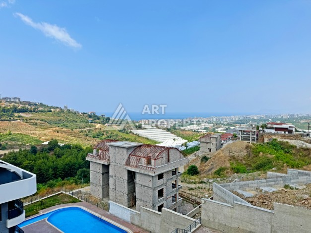 Двухуровневые апартаменты 2+1 с видом на море и горы в Каргыджаке, 112 кв.м. - Ракурс 9