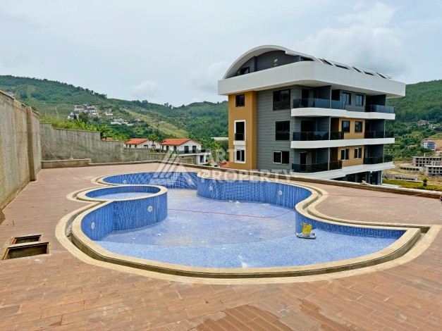 Двухуровневые апартаменты 2+1 с видом на море и горы в Каргыджаке, 112 кв.м. - Ракурс 12