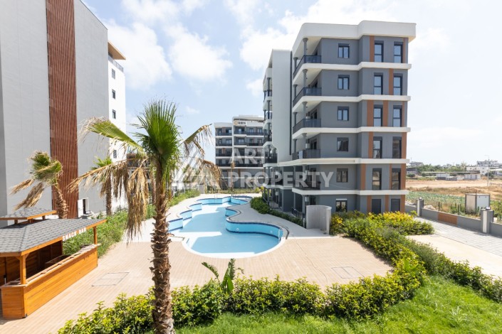 Современные квартиры 1+1 и 2+1 от 60 кв.м. в районе Алтынташ, Анталья - Ракурс 37