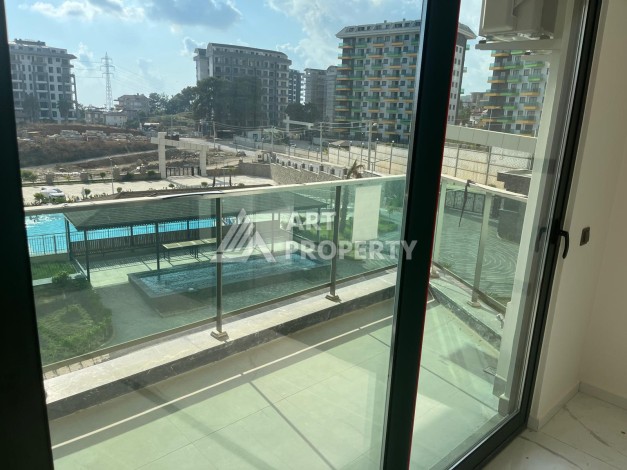 Апартаменты 1+1 с видом на бассейн, 50 кв.м. Авсаллар, Алания - Ракурс 5