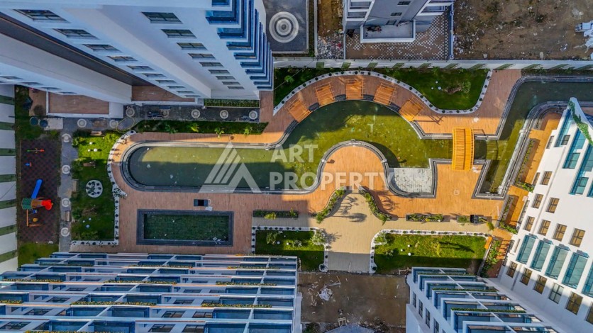 Просторная квартира 1+1 в центре Махмутлара, всего 700 м до моря - Ракурс 5