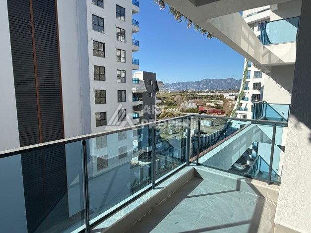 Просторная квартира 1+1 в центре Махмутлара, всего 700 м до моря - Ракурс 6