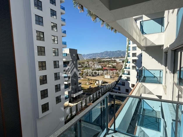 Просторная квартира 1+1 в центре Махмутлара, всего 700 м до моря - Ракурс 7