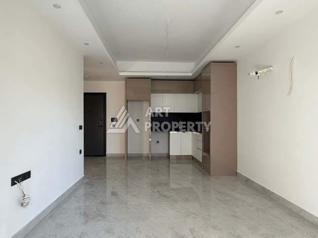 Просторная квартира 1+1 в центре Махмутлара, всего 700 м до моря - Ракурс 9