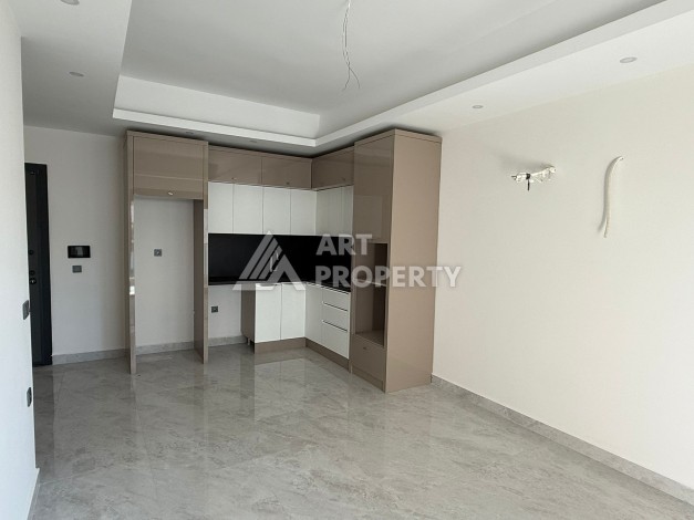 Просторная квартира 1+1 в центре Махмутлара, всего 700 м до моря - Ракурс 12