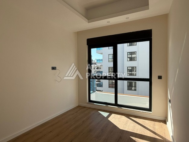 Просторная квартира 1+1 в центре Махмутлара, всего 700 м до моря - Ракурс 18