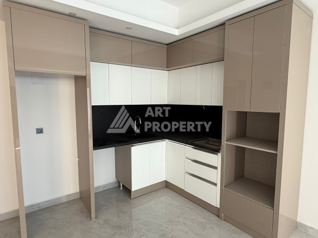 Современная квартира 1+1 на 10 этаже. Новая резиденция в центре Махмутлара. - Ракурс 2