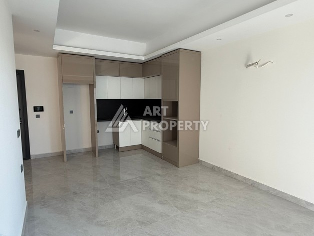 Современная квартира 1+1 на 10 этаже. Новая резиденция в центре Махмутлара. - Ракурс 3