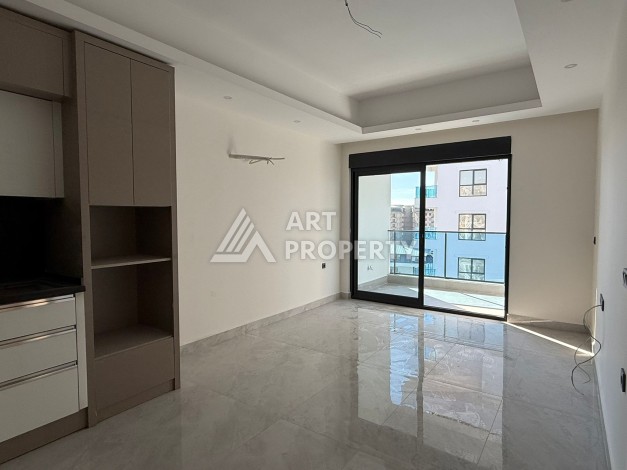 Современная квартира 1+1 на 10 этаже. Новая резиденция в центре Махмутлара. - Ракурс 4