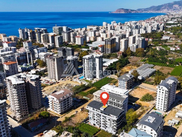 Квартира 1+1 в бутик-комплексе в Махмутларе, 55 кв.м. - Ракурс 2