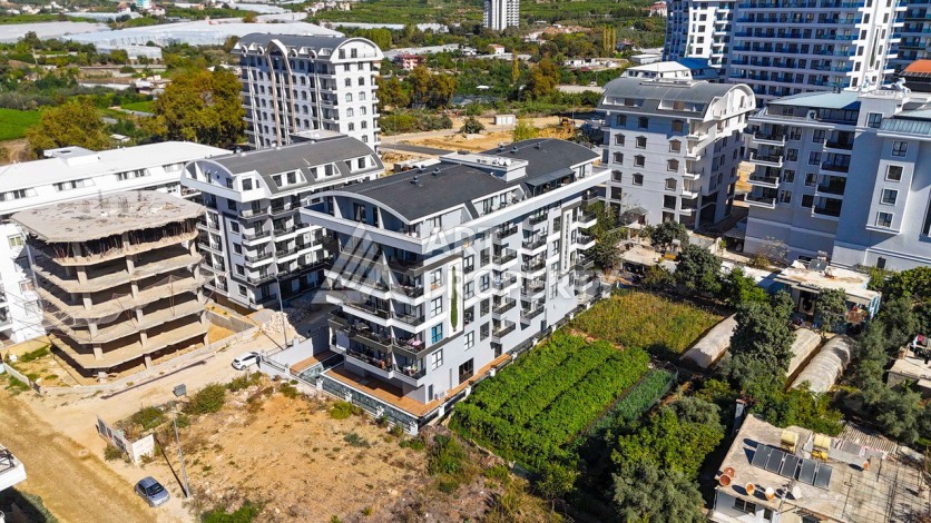 Квартира 1+1 в бутик-комплексе в Махмутларе, 55 кв.м. - Ракурс 3