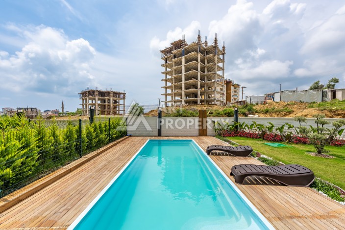 Квартира 1+1 с садом 170 кв.м. и приватным бассейном в Авсалларе. - Ракурс 2