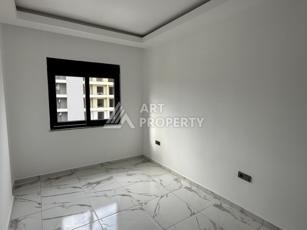 Квартиры 1+1 в центре Махмутлара, 47 кв.м. До моря всего 5 минут. - Ракурс 3