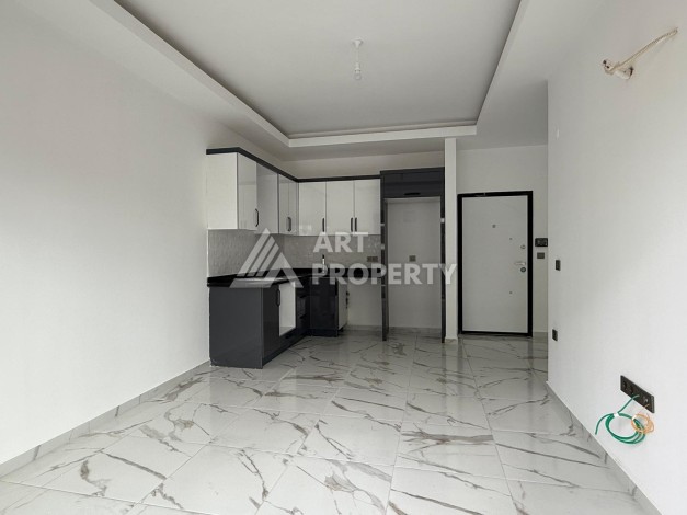 Квартиры 1+1 в центре Махмутлара, 47 кв.м. До моря всего 5 минут. - Ракурс 4