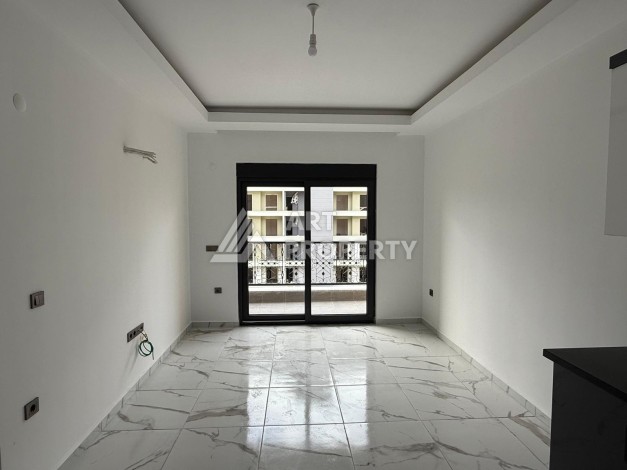 Квартиры 1+1 в центре Махмутлара, 47 кв.м. До моря всего 5 минут. - Ракурс 6