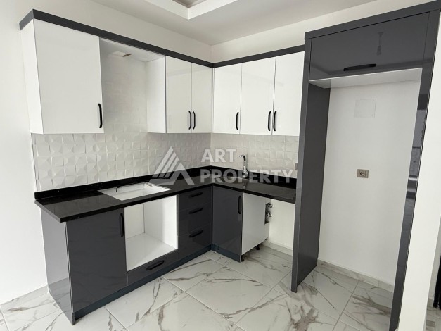 Квартиры 1+1 в центре Махмутлара, 47 кв.м. До моря всего 5 минут. - Ракурс 7