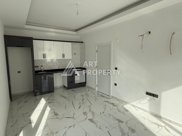 Квартиры 1+1 в центре Махмутлара, 47 кв.м. До моря всего 5 минут. - Ракурс 11