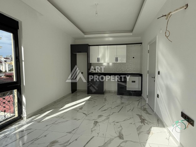 Квартиры 1+1 в центре Махмутлара, 47 кв.м. До моря всего 5 минут. - Ракурс 15