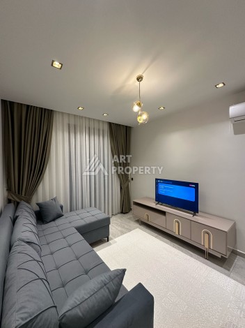 Квартира 1+1 в элитном ЖК с собственным пляжем в центре Алании, 50 кв.м. - Ракурс 2