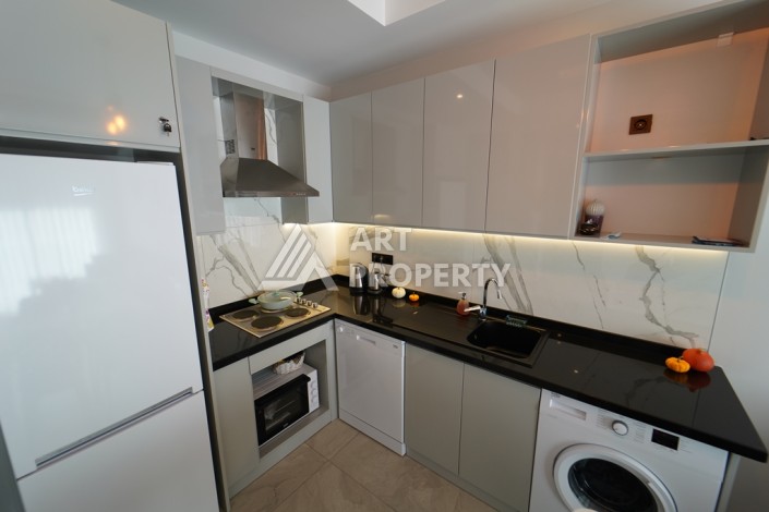 Меблированная квартира 1+1 в 5 минутах от пляжа Клеопатры. Супер локация, выгодная цена! - Ракурс 19