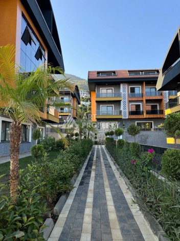 Двухуровневые апартаменты 2+1 и 3+1 с садом и террасой в центре Алании, Буюкхасбахче. - Ракурс 35