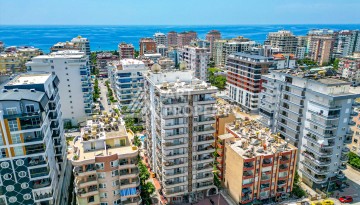 Светлая квартира 3+1 с видом на море в центре Махмутлара, 140 м² - Ракурс 3