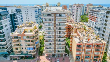 Светлая квартира 3+1 с видом на море в центре Махмутлара, 140 м² - Ракурс 1