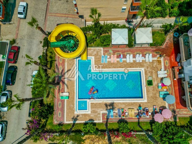 Светлая квартира 3+1 с видом на море в центре Махмутлара, 140 м² - Ракурс 1