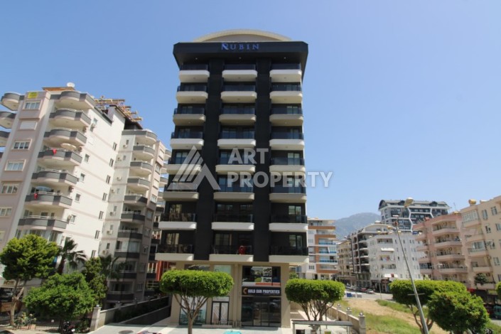 Квартира 2+1 в новом доме, 200 м до моря, в центре Махмутлара - Ракурс 2