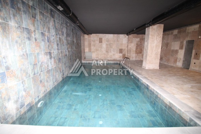 Квартира 2+1 в новом доме, 200 м до моря, в центре Махмутлара - Ракурс 8