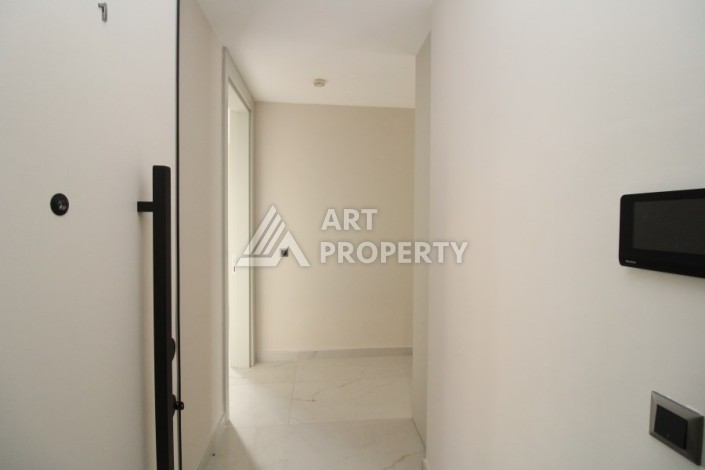 Квартира 2+1 в новом доме, 200 м до моря, в центре Махмутлара - Ракурс 11