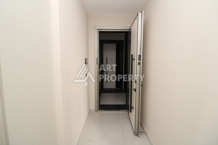 Квартира 2+1 в новом доме, 200 м до моря, в центре Махмутлара - Ракурс 13