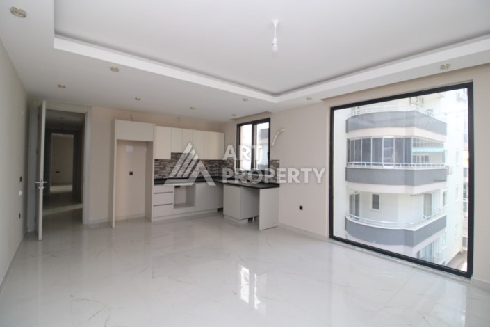 Квартира 2+1 в новом доме, 200 м до моря, в центре Махмутлара - Ракурс 16