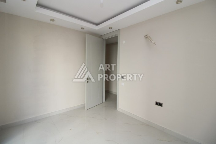 Квартира 2+1 в новом доме, 200 м до моря, в центре Махмутлара - Ракурс 20