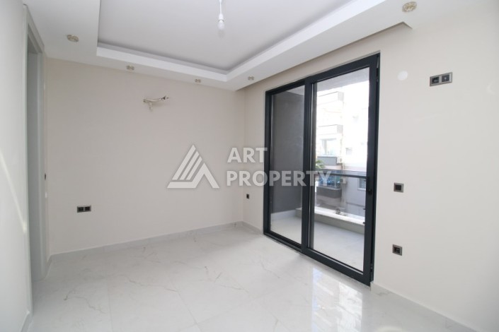 Квартира 2+1 в новом доме, 200 м до моря, в центре Махмутлара - Ракурс 21