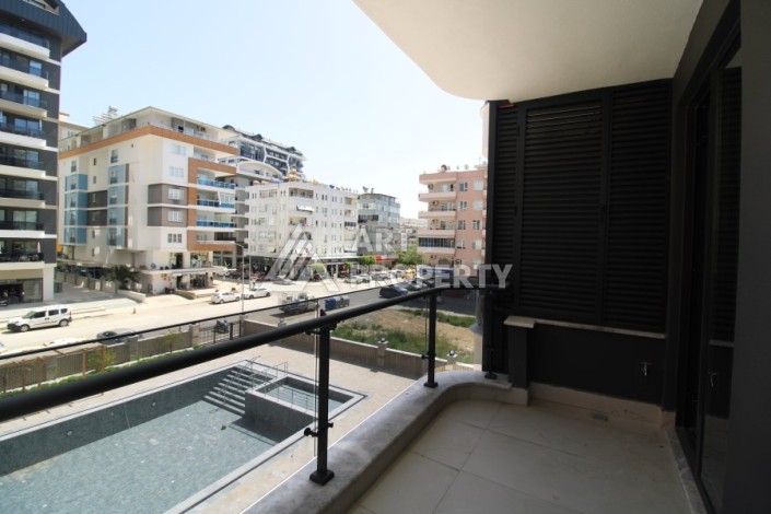 Квартира 2+1 в новом доме, 200 м до моря, в центре Махмутлара - Ракурс 22