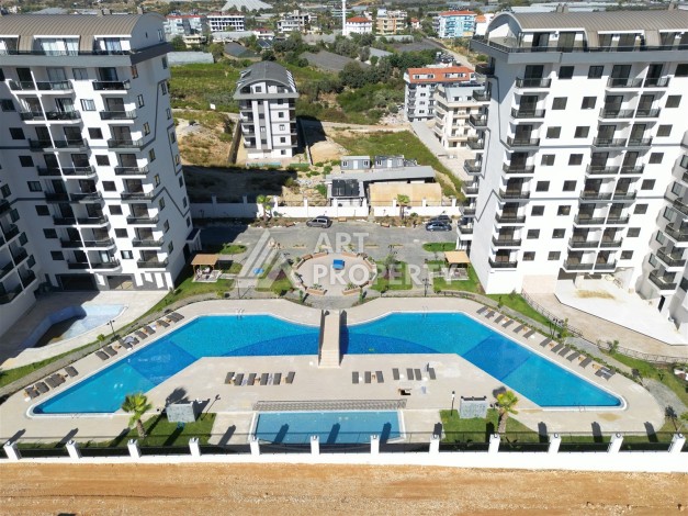 Стильная квартира 1+1 в открытом для ВНЖ районе, 55 кв.м. Паяллар, Алания - Ракурс 30