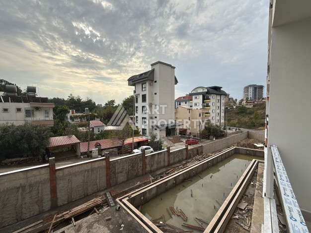 Квартира 1+1 с видом на бассейн в окружении сосен, 59 кв.м. Авсаллар, Алания - Ракурс 10